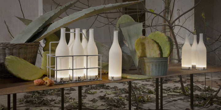 Lampa de masa in forma de sticla iluminata Bacco by Karman